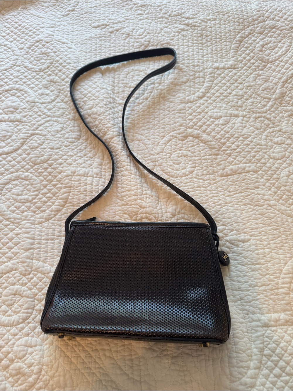 Monsac Black Perforated Crossbody Bag with Logo Charm